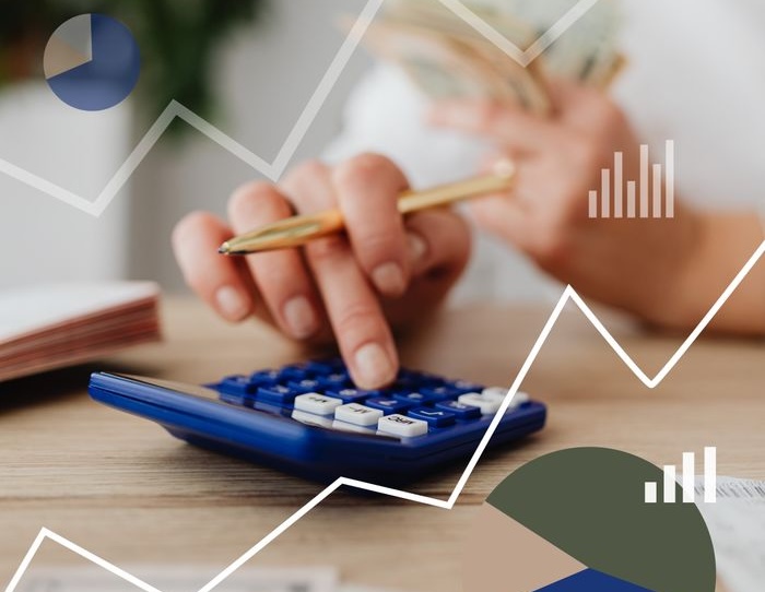 Financial Reports woman using a calculator cropped